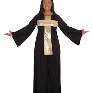 Dancer with outstretched arms wearing a black bell sleeve top with a gold lame cross across the front.