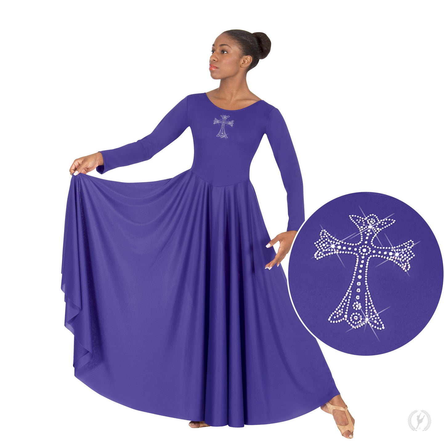 Dancer is wearing a purple long sleeve, full length dress with a scoop neck and rhinestone cross applique on the bodice.