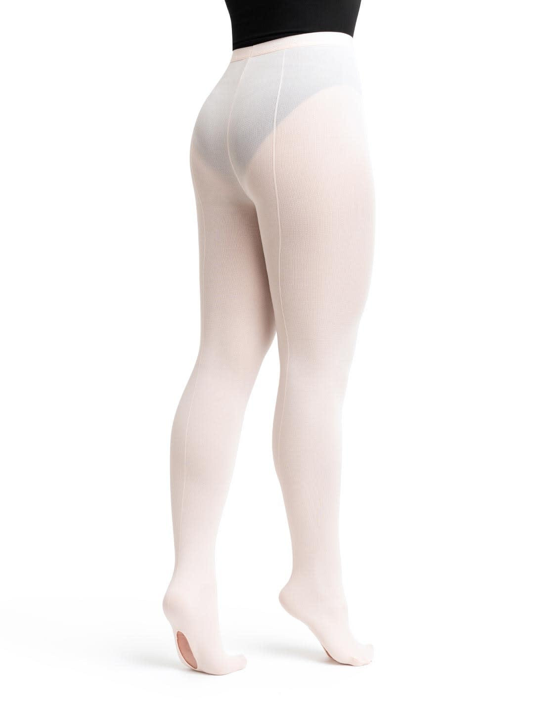 Dancer is wearing a pair of theatrical pink, mesh, convertible tights with an elastic waistband and a back seam down the leg. Dancer has paired the tights with a black leotard and is standing showing a back angle of the tight and the seamed hole in the left foot.