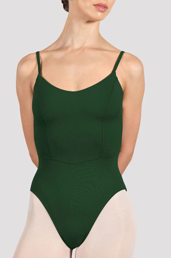 Dancer is wearing an evergreen, camisole leotard with a scoop neck and back and bodice seam detail. 