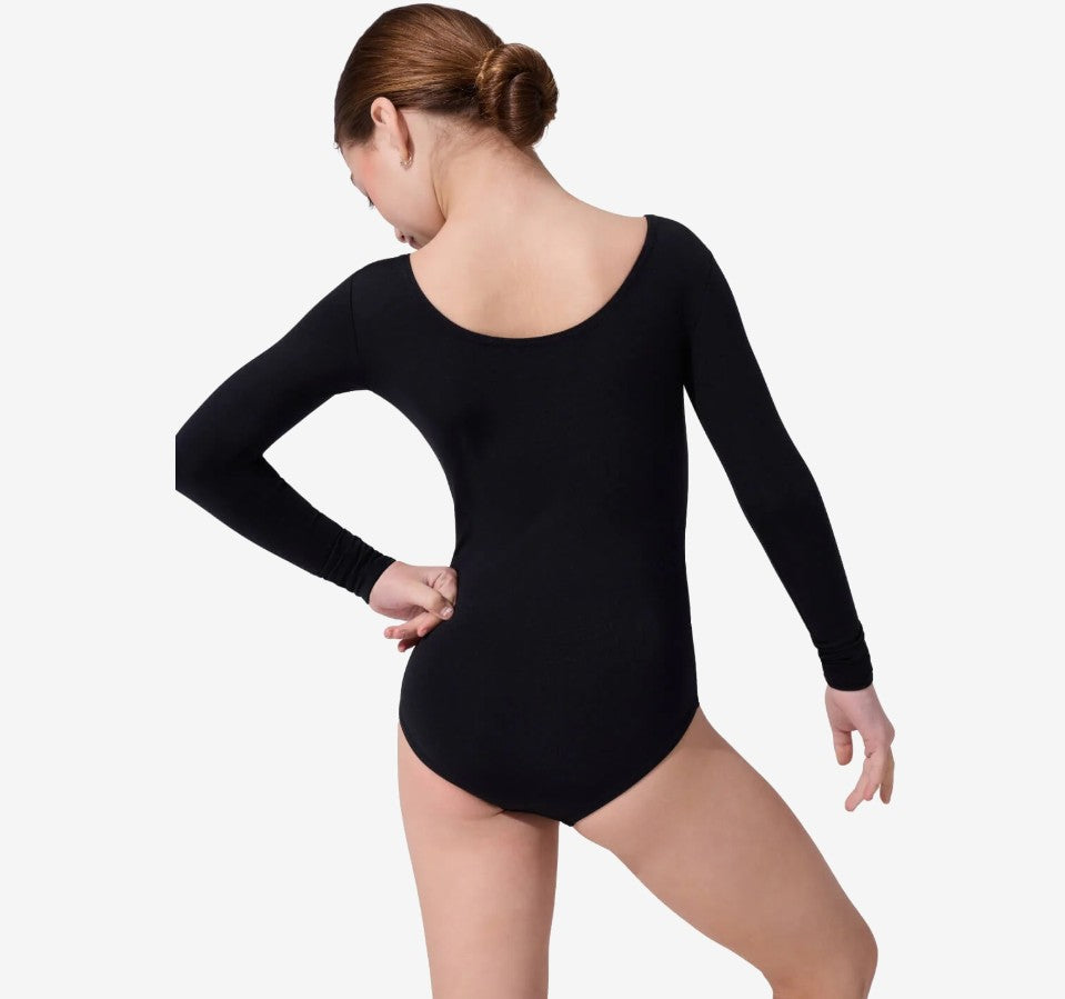 Back angle of a dancer wearing a black, long sleeve leotard with a moderate scoop front and back. She is standing with her left hand at her hip.