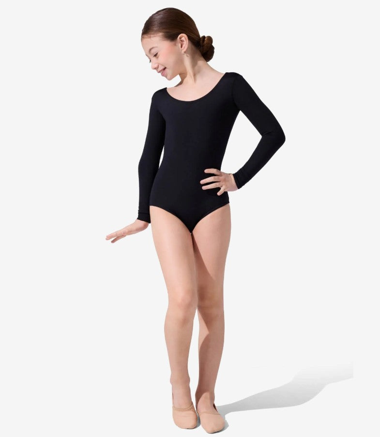 Dancer is wearing a black, long sleeve leotard with a moderate scoop front and back. She has paired the garment with lyrical dance shoes and has her left hand at her hip.