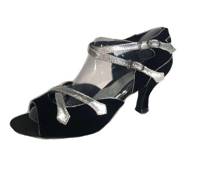 A  pair of Latin ballroom shoes with a 2" flared heel featuring a black velvet vamp and heel with silver trim. Side double buckle closure.