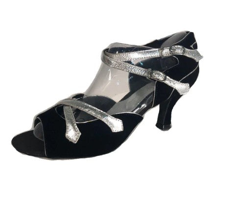 A  pair of Latin ballroom shoes with a 2" flared heel featuring a black velvet vamp and heel with silver trim. Side double buckle closure.