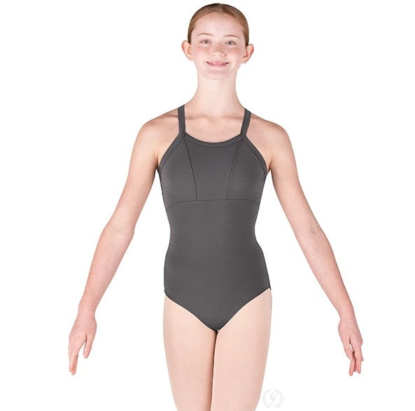 Dancer is wearing a grey, wide strap, camisole leotard with princess seams and back straps that cross. Dancer has paired the garment with pink tights and has her arms in a demi second position.