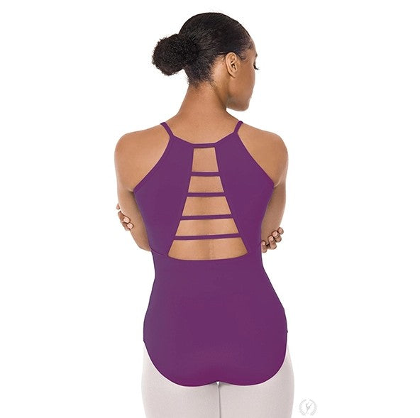 Dancer is showing a back angle of an eggplant, camisole leotard with a scoop neckline and ladder cut out back.