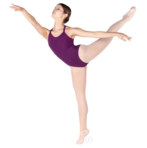 Dancer is wearing an eggplant, wide strap, camisole leotard with princess seams, empire waist and a low, squared off back with criss- cross straps. Dancer has paired the garment with pink tights and ballet shoes and is balancing in an arabesque ballet position.