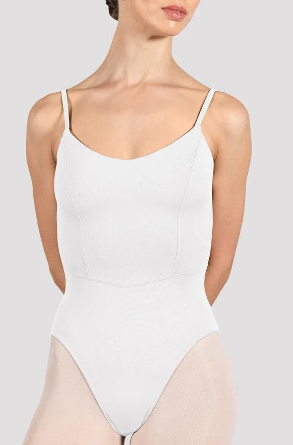 Dancer is wearing a white, camisole leotard with a scoop neck and back and bodice seam detail. 