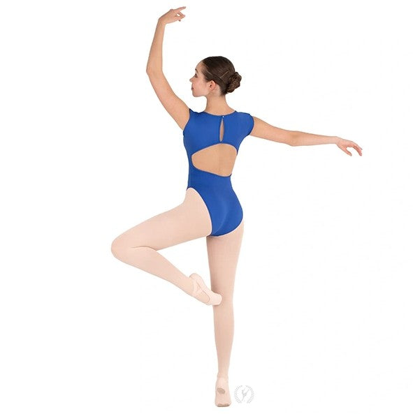 Dancer is showing a back angle of a royal blue, boatneck, cap sleeve leotard with an open mid back and elasticized button closure. She has paired the garment with pink tights and ballet shoes and is balancing in a releve passe ballet position with her left arm in a high fifth position.