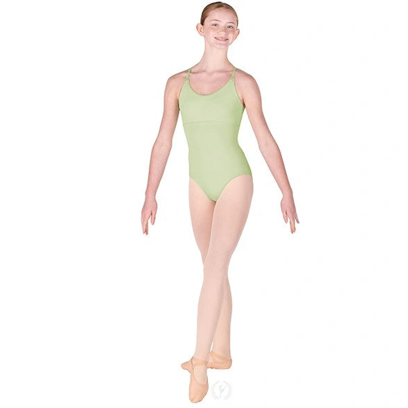 Dancer is wearing a multi-wear, adjustable, camisole leotard with a keyhole back in seafoam. She has paired the garment with pink tights and ballet shoes and is standing with her left foot pointed forward.