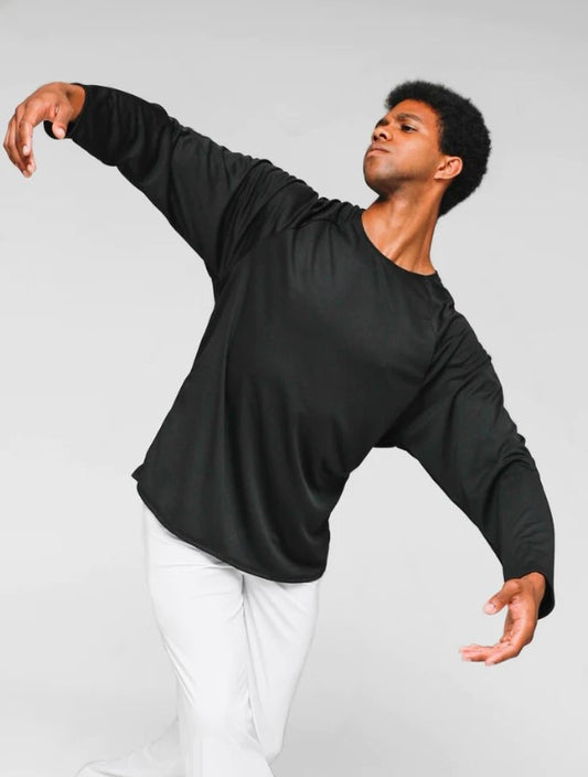 Dancer is wearing a long-sleeved black pullover shirt with a round neckline and white pants.